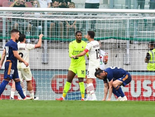 Mike Maignan of AC Milan saves a penalty during the pre-season friendly match between Real Madrid and AC Milan at Worthersee Stadion on August 08,...