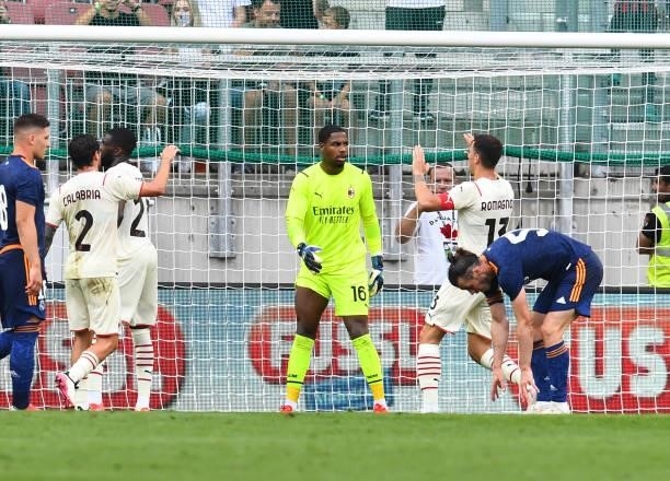 Mike Maignan of AC Milan saves a penalty during the pre-season friendly match between Real Madrid and AC Milan at Worthersee Stadion on August 08,...