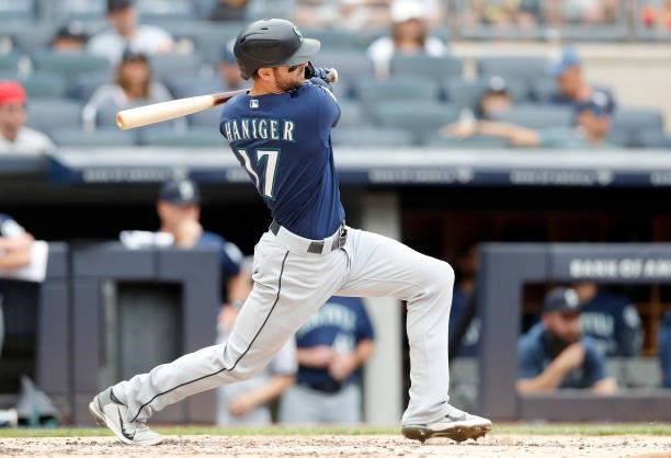 Mitch Haniger of the Seattle Mariners singles during the third inning against the New York Yankees at Yankee Stadium on August 08, 2021 in New York...