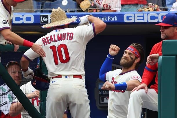 Realmuto of the Philadelphia Phillies is congratulated by Bryce Harper after he hit a home run against the New York Mets during the first inning of a...