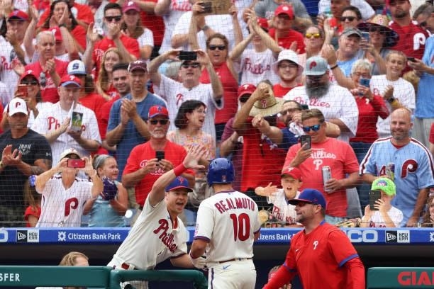 Realmuto of the Philadelphia Phillies is congratulated by Andrew Knapp after he hit a home run against the New York Mets during the first inning of a...