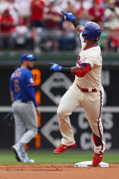 Jean Segura of the Philadelphia Phillies gestures as he rounds the bases after hitting a home run against the New York Mets during the first inning...