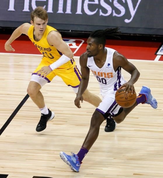 Jaleen Smith of the Phoenix Suns brings the ball up the court against Mac McClung of the Los Angeles Lakers during the 2021 NBA Summer League at the...