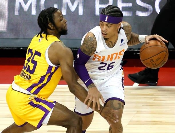 Nate Mason of the Phoenix Suns brings the ball up the court against Zavier Simpson of the Los Angeles Lakers during the 2021 NBA Summer League at the...