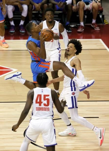 Theo Maledon of the Oklahoma City Thunder drives to the basket against Cade Cunningham Detroit Pistons during the 2021 NBA Summer League at the...