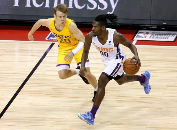 Jaleen Smith of the Phoenix Suns brings the ball up the court against Mac McClung of the Los Angeles Lakers during the 2021 NBA Summer League at the...
