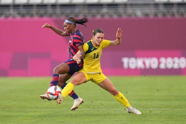 Hayley Raso of Australia challenges Crystal Dunn of the United States for the ball during a game between Australia and USWNT at Kashima Soccer...