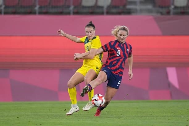 Lindsey Horan of the United States battles for the ball with Caitlin Foord of Australia during a game between Australia and USWNT at Kashima Soccer...