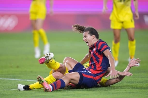 Tobin Heath of the United States falls during a game between Australia and USWNT at Kashima Soccer Stadium on August 5, 2021 in Kashima, Japan.