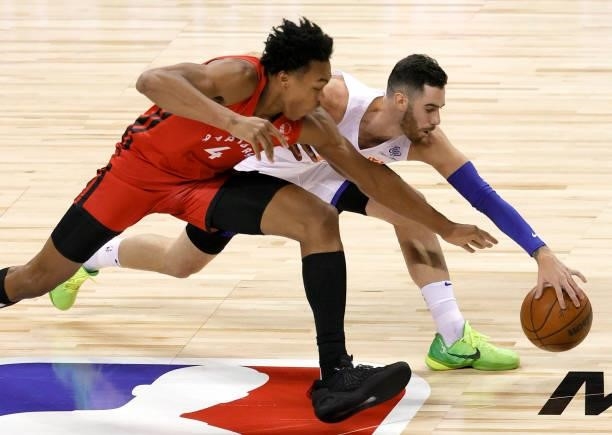 Scottie Barnes of the Toronto Raptors steals the ball from Luca Vildoza of the New York Knicks during the 2021 NBA Summer League at the Thomas & Mack...