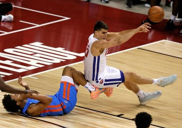 Luka Garza of the Detroit Pistons gets rid of the ball as he is fouled by Jeremiah Robinson-Earl of the Oklahoma City Thunder during the 2021 NBA...