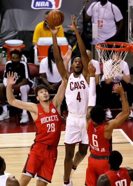 Evan Mobley of the Cleveland Cavaliers catches a pass against Alperen Sengun of the Houston Rockets during the 2021 NBA Summer League at the Thomas &...