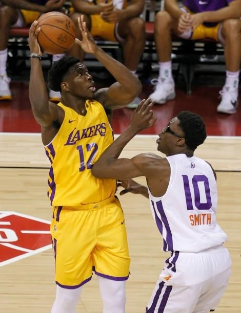 Devontae Cacok of the Los Angeles Lakers shoots against Jalen Smith of the Phoenix Suns during the 2021 NBA Summer League at the Thomas & Mack Center...
