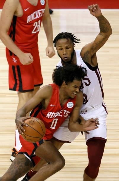 Jalen Green of the Houston Rockets drives against Lamar Stevens of the Cleveland Cavaliers during the 2021 NBA Summer League at the Thomas & Mack...