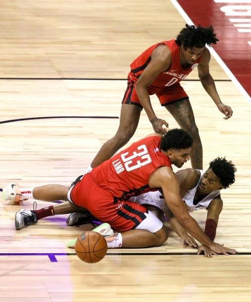 Jaylen Hands of the Cleveland Cavaliers passes from the floor against Anthony Lamb and Jalen Green of the Houston Rockets during the 2021 NBA Summer...