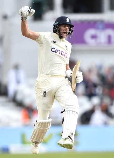 Joe Root of England celebrates after scoring 100 runs during day four of the First Test Match between England and India at at Trent Bridge on August...