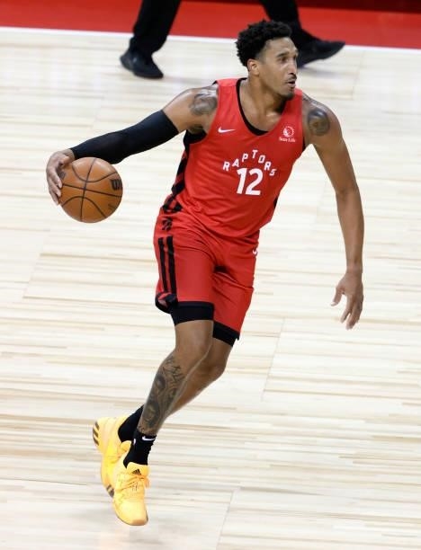 Ishmail Wainright of the Toronto Raptors brings the ball up the court against the New York Knicks during the 2021 NBA Summer League at the Thomas &...