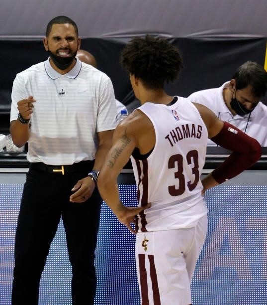 Head coach J.J. Outlaw of the Cleveland Cavaliers talks with Brodric Thomas during their game against the Houston Rockets during the 2021 NBA Summer...
