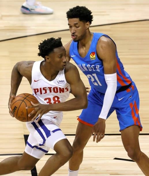 Saben Lee of the Detroit Pistons drives against Aaron Wiggins of the Oklahoma City Thunder during the 2021 NBA Summer League at the Thomas & Mack...