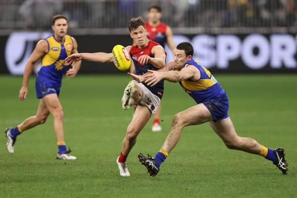 Jeremy McGovern of the Eagles smothers the kick of Jake Melksham of the Demons during the round 21 AFL match between West Coast Eagles and Melbourne...