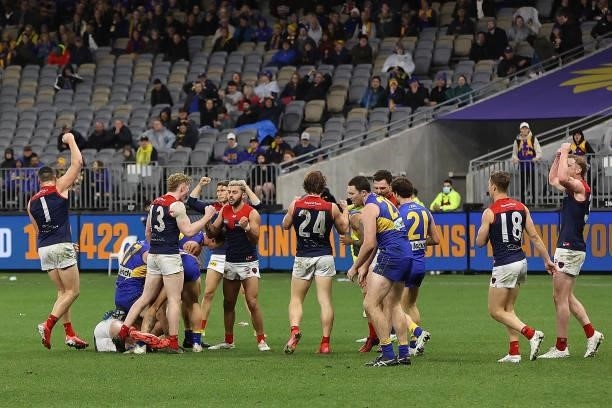 The Demons celebrate winning the round 21 AFL match between West Coast Eagles and Melbourne Demons at Optus Stadium on August 09, 2021 in Perth,...