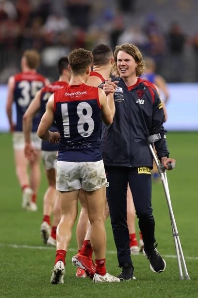 Jayden Hunt of the Demons is seen on crutches after winning the round 21 AFL match between West Coast Eagles and Melbourne Demons at Optus Stadium on...