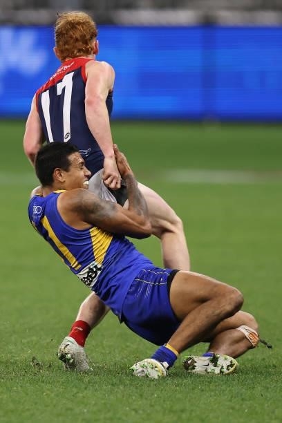 Tim Kelly of the Eagles tackles Jake Bowey of the Demons during the round 21 AFL match between West Coast Eagles and Melbourne Demons at Optus...