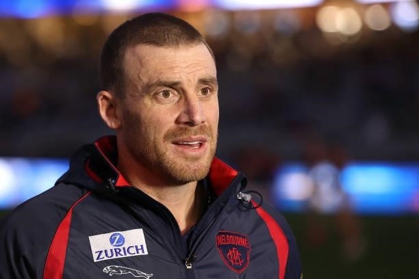 Simon Goodwin, Senior Coach of the Demons is interviewed before the start of the game during the round 21 AFL match between West Coast Eagles and...