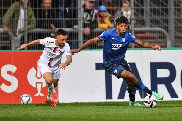 Hoffenheims Georginio Rutter challenges Colognes Simon Handle during the DFB Cup first round match between Viktoria Köln and 1899 Hoffenheim on...