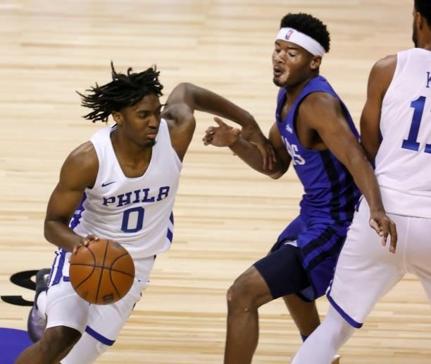 Tyrese Maxey of the Philadelphia 76ers drives against Devontae Shuler of the Dallas Mavericks during the 2021 NBA Summer League at the Thomas & Mack...