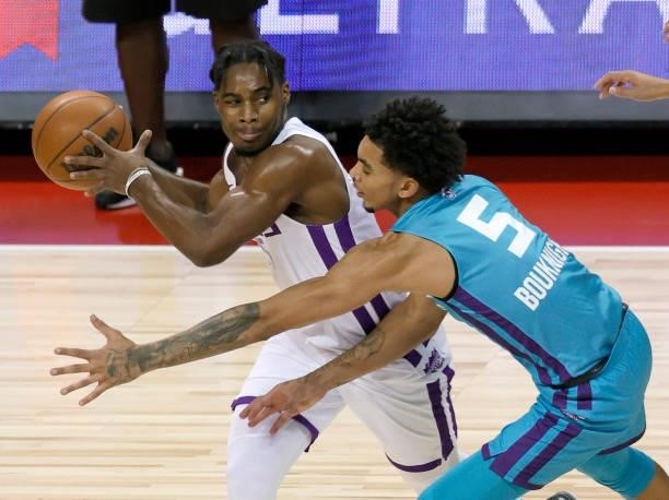 Davion Mitchell of the Sacramento Kings is guarded by James Bouknight of the Charlotte Hornets during the 2021 NBA Summer League at the Thomas & Mack...