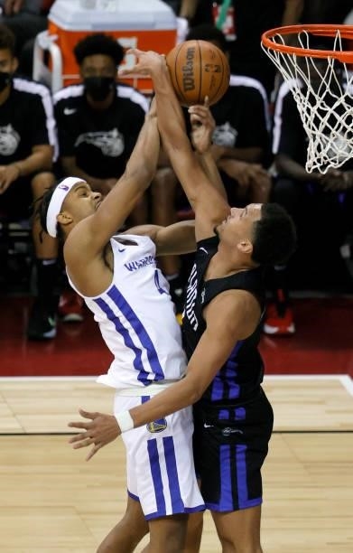Jalen Suggs of the Orlando Magic blocks a shot by Moses Moody of the Golden State Warriors late in the fourth quarter of their game during the 2021...