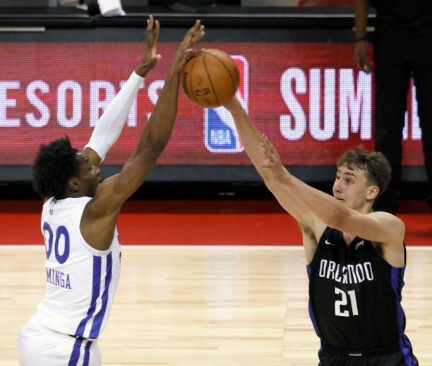 Jonathan Kuminga of the Golden State Warriors blocks a shot by Franz Wagner of the Orlando Magic during the 2021 NBA Summer League at the Thomas &...