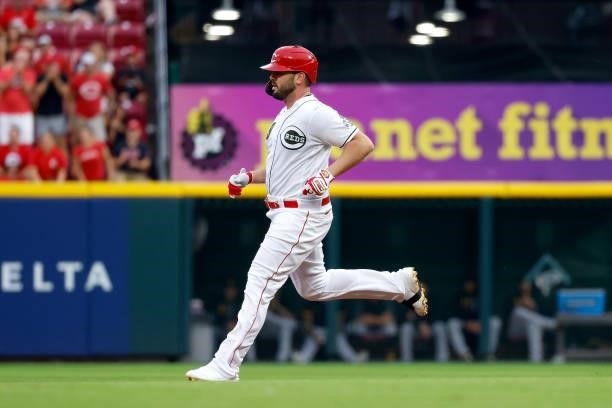 Mike Moustakas of the Cincinnati Reds runs to second base after hitting a double during the game against the Pittsburgh Pirates at Great American...