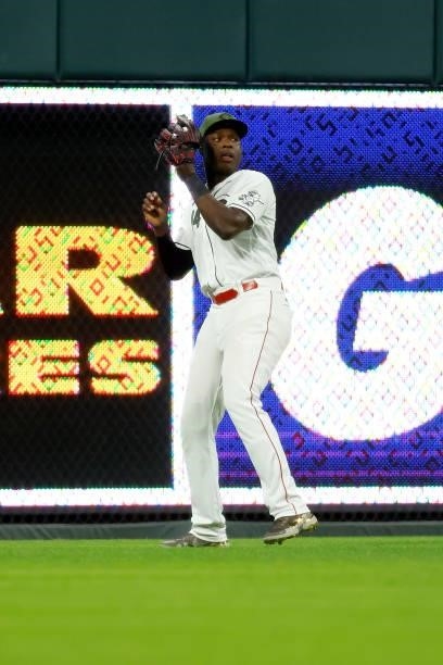 Aristides Aquino of the Cincinnati Reds throws the ball back to the infield during the game against the Pittsburgh Pirates at Great American Ball...