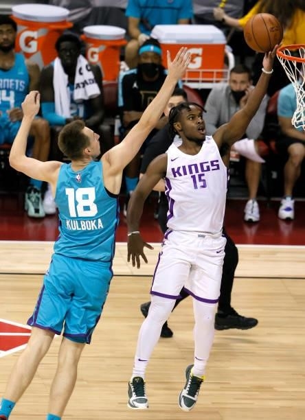 Davion Mitchell of the Sacramento Kings shoots a layup against Arnoldas Kulboka of the Charlotte Hornets of the Sacramento Kings during the 2021 NBA...