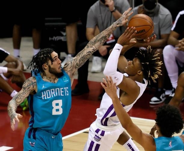 LiAngelo Ball of the Charlotte Hornets fouls Jahmi'us Ramsey of the Sacramento Kings during the 2021 NBA Summer League at the Thomas & Mack Center on...