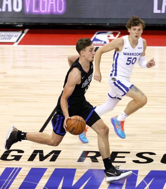 Franz Wagner of the Orlando Magic brings the ball up the court against Kyle Guy of the Golden State Warriors during the 2021 NBA Summer League at the...