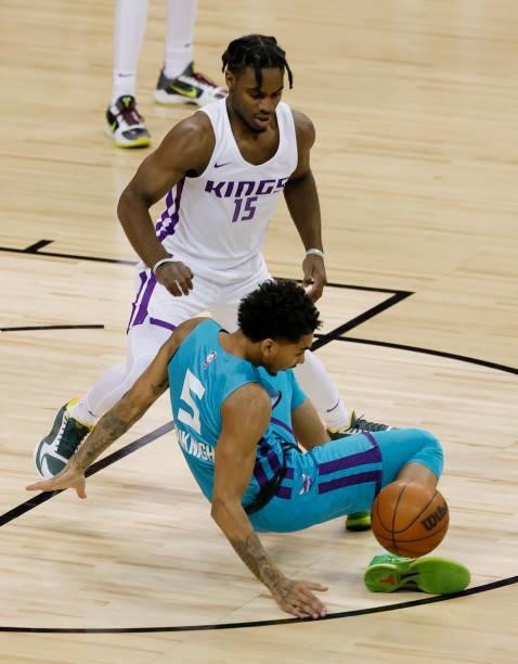 James Bouknight of the Charlotte Hornets loses the ball to Davion Mitchell of the Sacramento Kings during the 2021 NBA Summer League at the Thomas &...