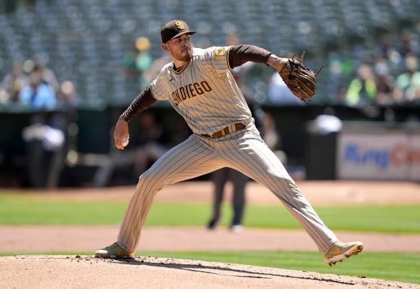 Joe Musgrove of the San Diego Padres pitches against the Oakland Athletics in the bottom of the first inning at RingCentral Coliseum on August 04,...