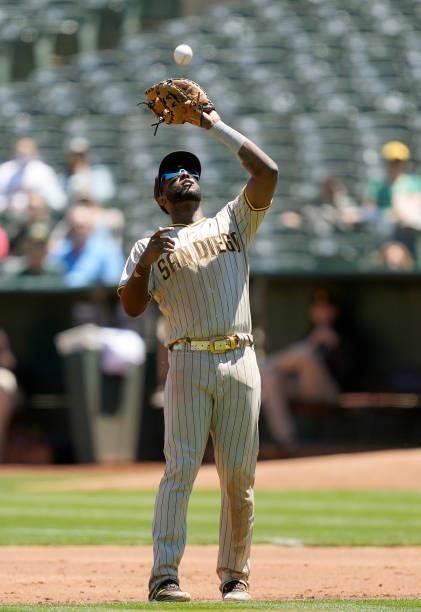 Jurickson Profar of the San Diego Padres catches a pop-up off the bat of Matt Chapman of the Oakland Athletics in the bottom of the second inning at...