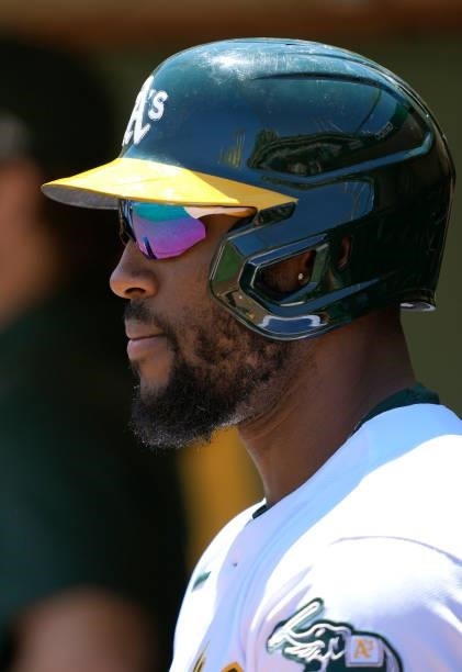 Starling Marte of the Oakland Athletics looks on from the dugout against the San Diego Padres in the bottom of the second inning at RingCentral...