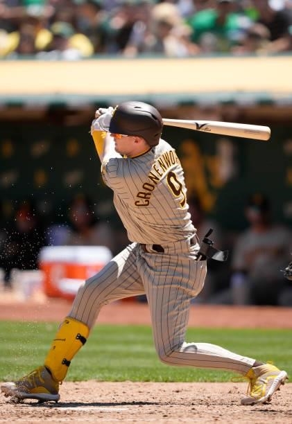 Jake Cronenworth of the San Diego Padres bats against the Oakland Athletics in the top of the fourth inning at RingCentral Coliseum on August 04,...