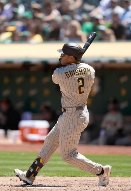 Trent Grisham of the San Diego Padres hits an RBI double scoring Eric Hosmer against the Oakland Athletics in the top of the fourth inning at...