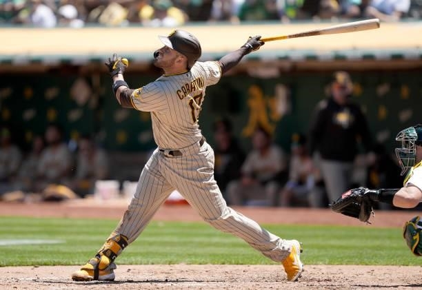 Victor Caratini of the San Diego Padres bats against the Oakland Athletics in the top of the fourth inning at RingCentral Coliseum on August 04, 2021...