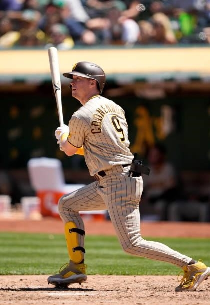 Jake Cronenworth of the San Diego Padres bats against the Oakland Athletics in the top of the six inning at RingCentral Coliseum on August 04, 2021...