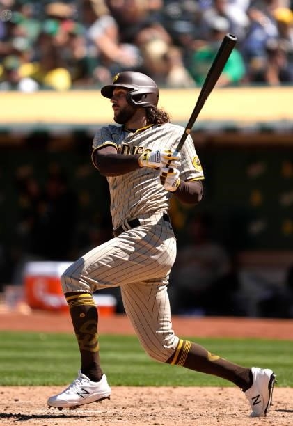 Jake Marisnick of the San Diego Padres bats against the Oakland Athletics in the top of the seventh inning at RingCentral Coliseum on August 04, 2021...