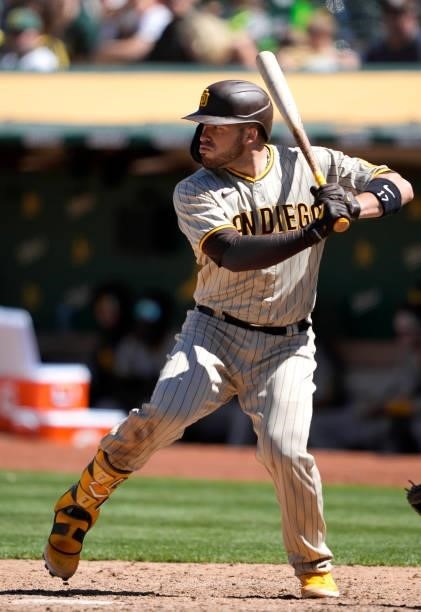 Victor Caratini of the San Diego Padres bats against the Oakland Athletics in the top of the ninth inning at RingCentral Coliseum on August 04, 2021...