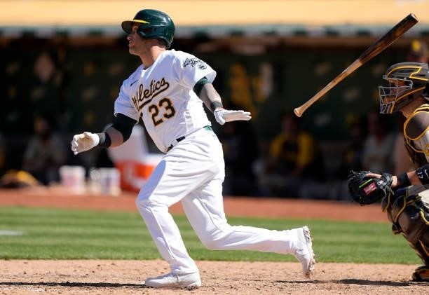 Yan Gomes of the Oakland Athletics hits a pinch hit RBI single scoring Tony Kemp against the San Diego Padres in the bottom of the ninth inning at...