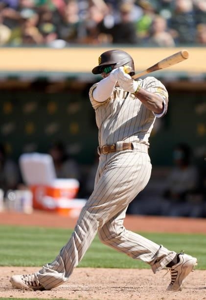 Manny Machado of the San Diego Padres bats against the Oakland Athletics in the top of the tenth inning at RingCentral Coliseum on August 04, 2021 in...